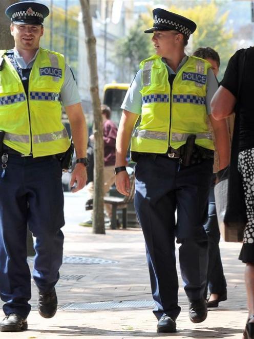 Constable Ben West (left) and Constable Jo Ammundsen walk along George St yesterday afternoon....