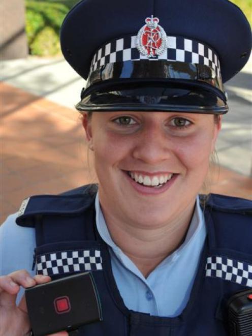 Constable Jo Ammundsen is one of 15 Dunedin police officers testing  new personal safety devices....