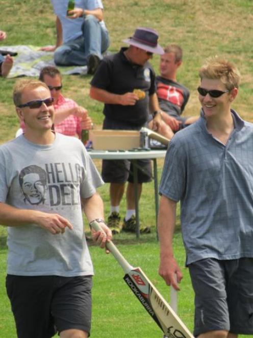 Constables Craig Gibson (left) and Dave Falstead step out to bat. Photos by James Beech.