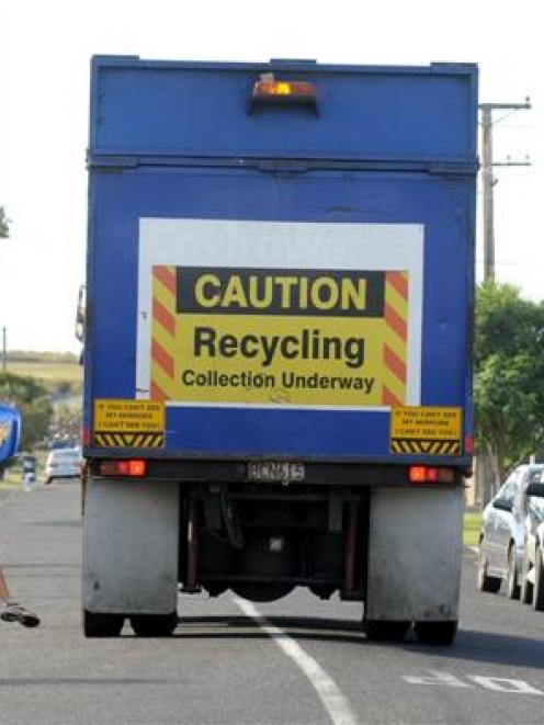 Contractors rush to clear the streets of South Dunedin of recycling. From October next year, they...