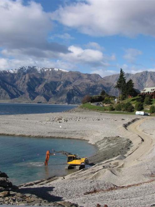 Contractors work to extract 1600cu m of gravel from the face of the Hawea dam this week. Photo by...