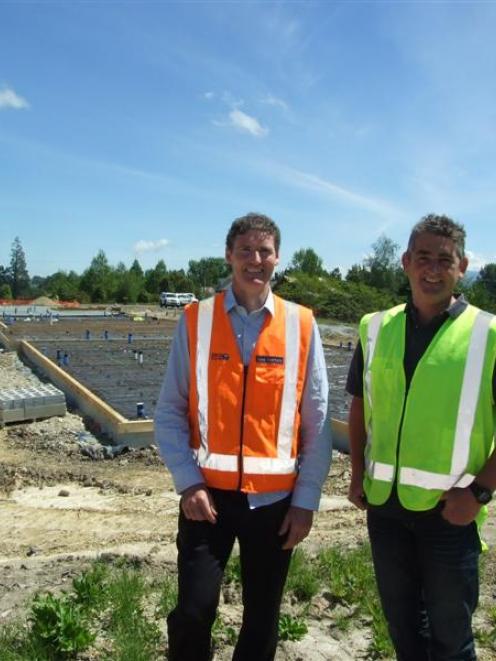 Cook Brothers Construction project manager Glenn Forrester (left) and West Otago Health Trust...