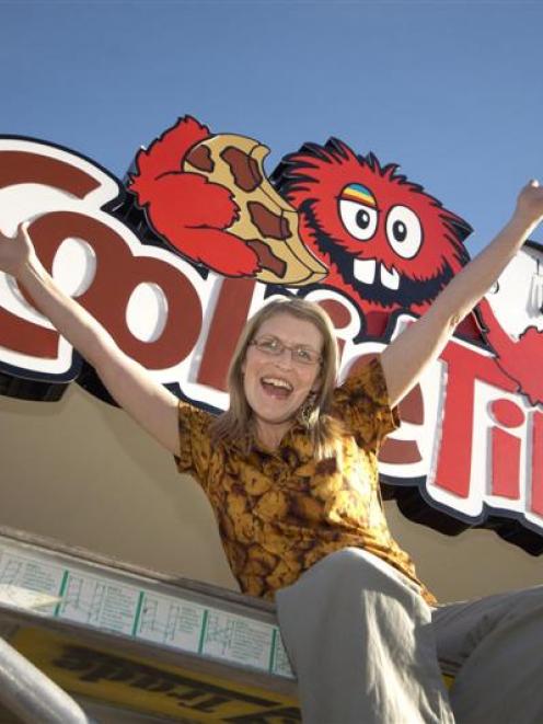 Cookie Time franchisee Verity Richard celebrates as the sign goes up on the new Queenstown store,...