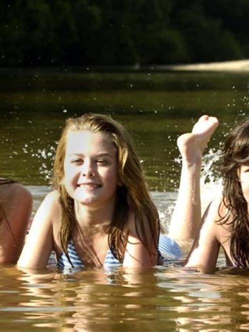 Cooling off in the Outram Glen, near Dunedin,  yesterday are Lynsey Macaskill (14), Georgia...