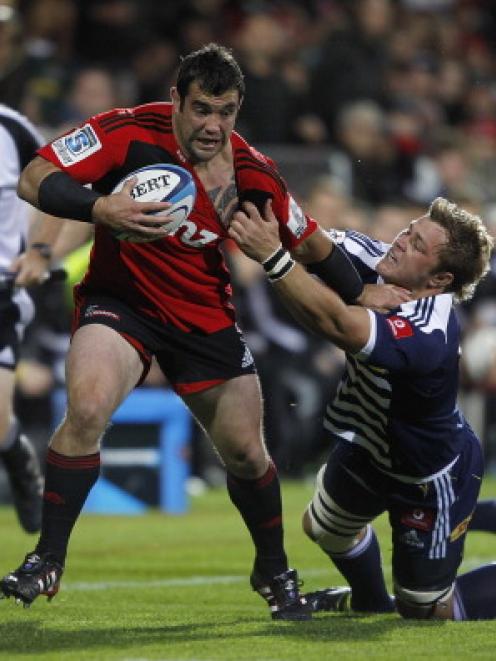 Cory Flynn of the Crusaders is tackled during the round eight Super 15 match against the Stormers...