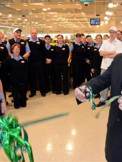 Countdown Dunedin South store manager Paul Wallace and his staff watch Dunedin Mayor Dave Cull...