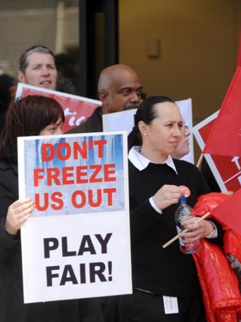 Court staff continue their rolling stop works for a pay increase outside the District Court,...