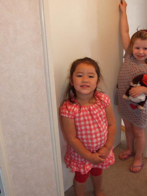 Cousins Mackenzie Ah Mann (left) and Georgia Weir after their rescue yesterday. Photo by Lynda...