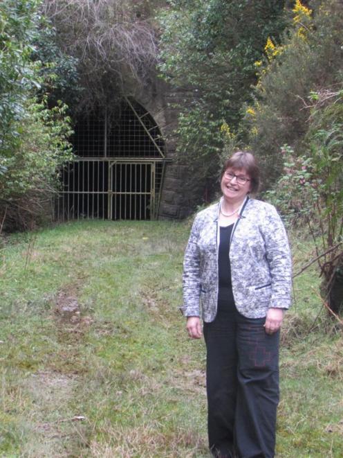 Cr Kate Wilson in front of the Wingatui entrance to the Chain Hills tunnel last week. Photo by...