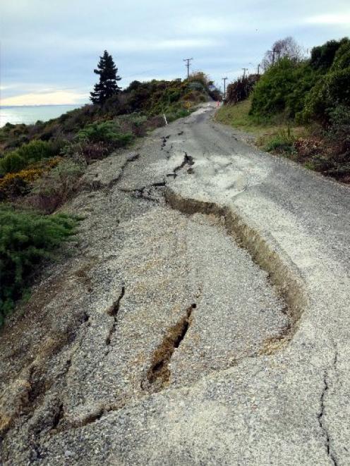 Cracks and slumps on the closed section of Haven St. Photo by Bill Campbell.