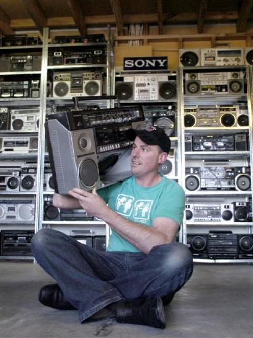 Craig Kenton with his collection of ghetto blasters. Photo by Jane Dawber.