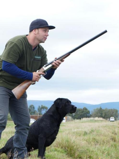 Craig Marshall and his dog, Tika, winning the limit-retrieving event  at the club's South Island...