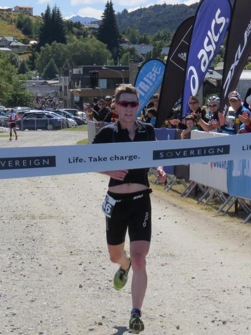 Craig Savage, of Christchurch, crosses the line to win the Wanaka round of the Tri Series...