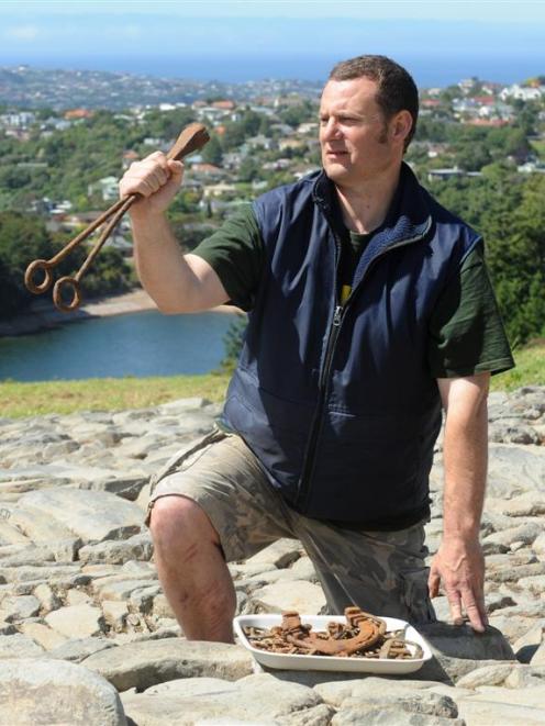 Craigieburn Reserve project manager Paul Pope holds a branding iron found at the site during...