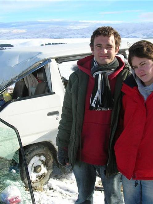 London couple Malcolm Skinner and Louise Taylor wait for police to arrive at the scene of their...