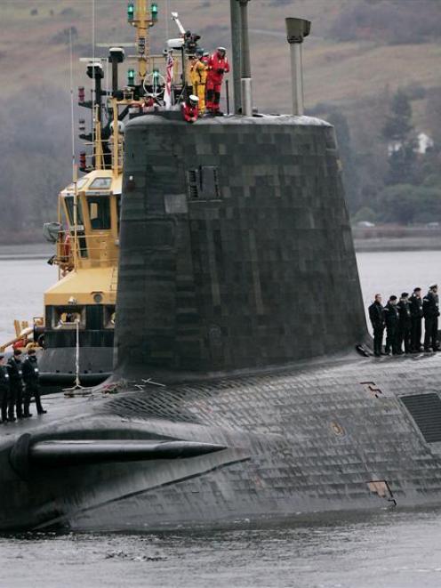 Crew from HMS Vengeance, a British Royal Navy Vanguard class Trident ballistic missile submarine,...