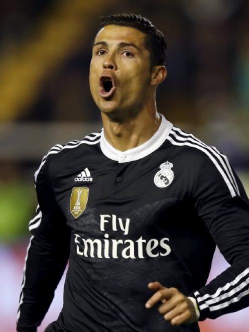 Cristiano Ronaldo celebrates scoring for Real Madrid against Rayo Vallecano during their Spanish...