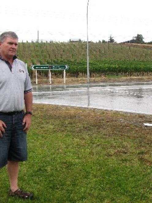 Cromwell Community Board chairman Neil Gillespie yesterday watches traffic at the intersection...