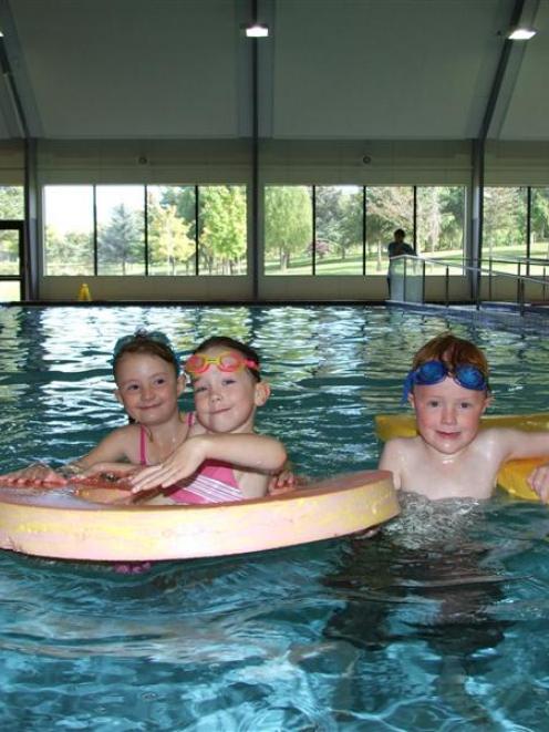 Cromwell swimmers (from left) Hope Oldham (8), Emma Connell (5) and Christian Oldham (6) are...