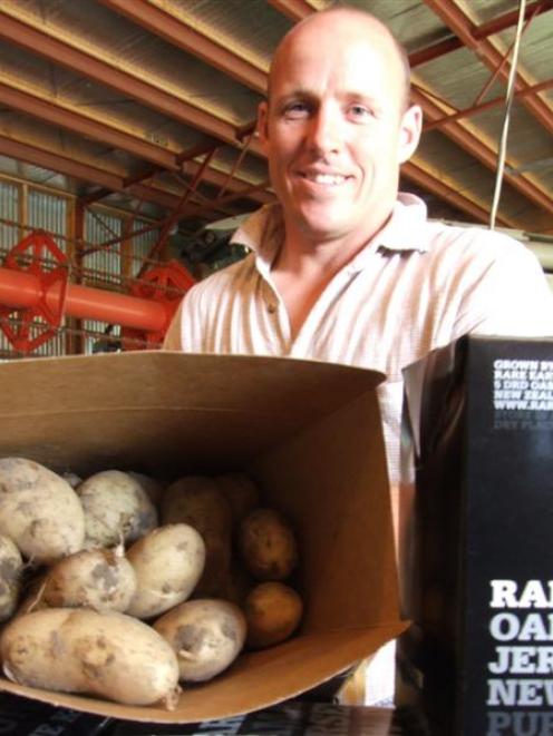 Cropping farmer Nick Webster takes a break from packing new potatoes at Totara.