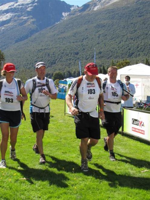 Crossing the finish line in third place in the Cure Kids Great Adventure Race on Saturday is the...