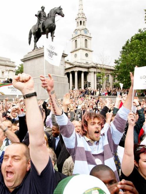 Crowds in London's Trafalgar Square celebrate as the announcement is made that London will host...