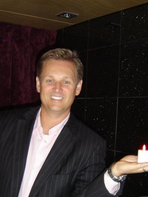 Crowne Plaza Queenstown general manager Brett Wilson gets ready to mark Earth Hour, between 8...