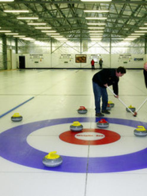 The ancient Scottish sport of Curling - a game being played in the new curling dedicated rink at...