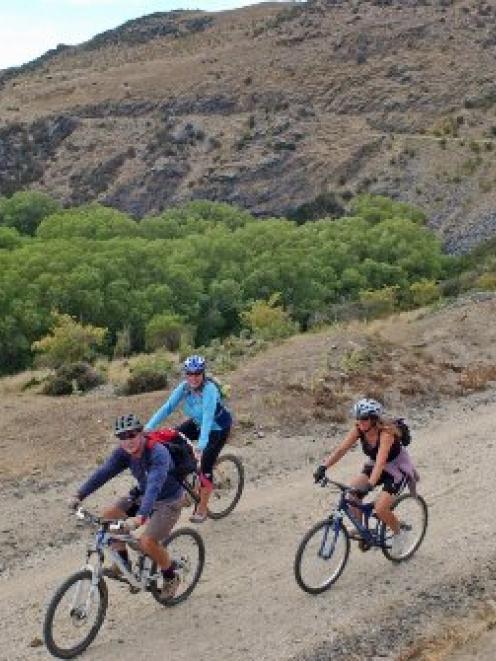 Cyclists enjoy the Otago Central Rail Trail between Hyde and Daisybank. Photo by John Fridd