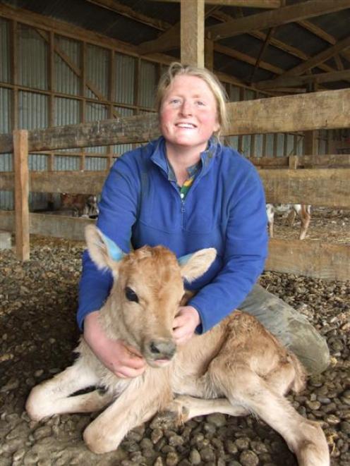Dairy farm worker Philippa Henderson with a 2-day-old  calf at her Clydevale workplace. Photo by...