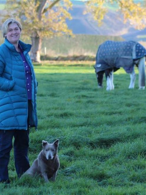 Dairy Women's Network North Otago convener Julie Dee at home at Ikawai with her kelpie dog Rum....