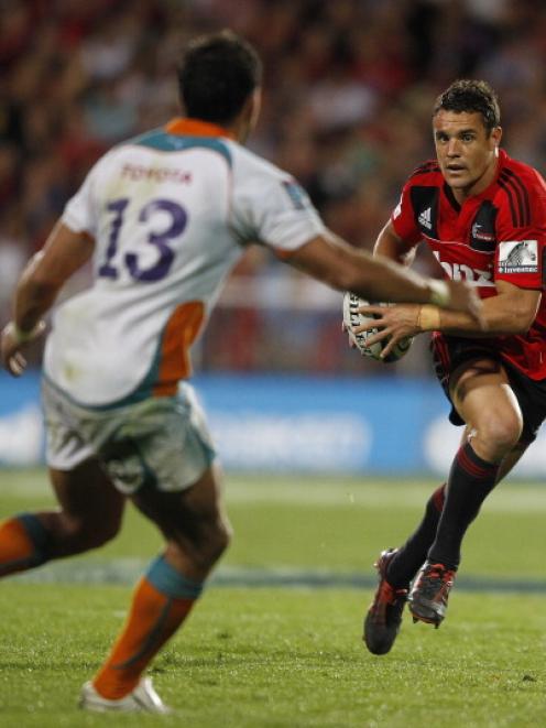 Dan Carter of the Crusaders runs at Robert Ebersohn of the Cheetahs during their Super 15 match...