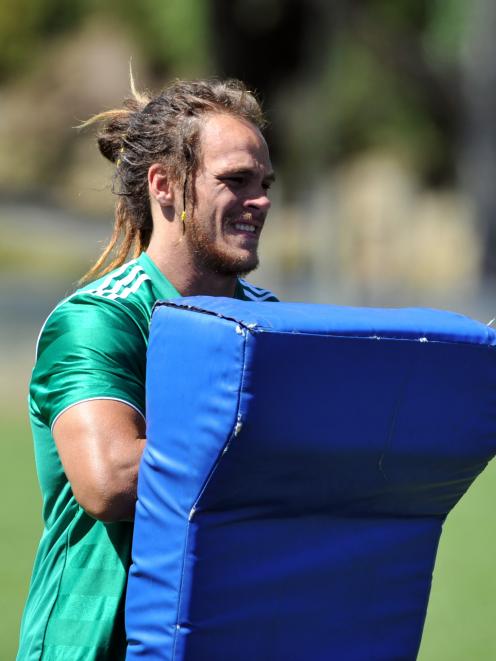 Dan Pryor holds a tackle bag at training at Logan Park yesterday. Photo by Gregor Richardson.