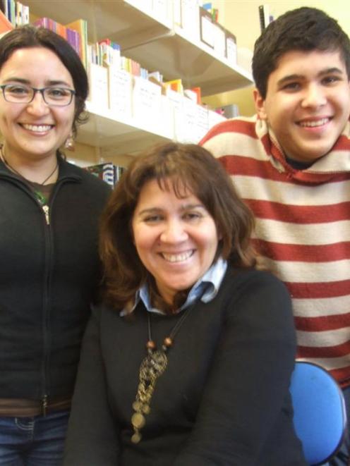 Daniela Gonzalez (left) has been helping Maria and Felipe Valtiette improve their English at...