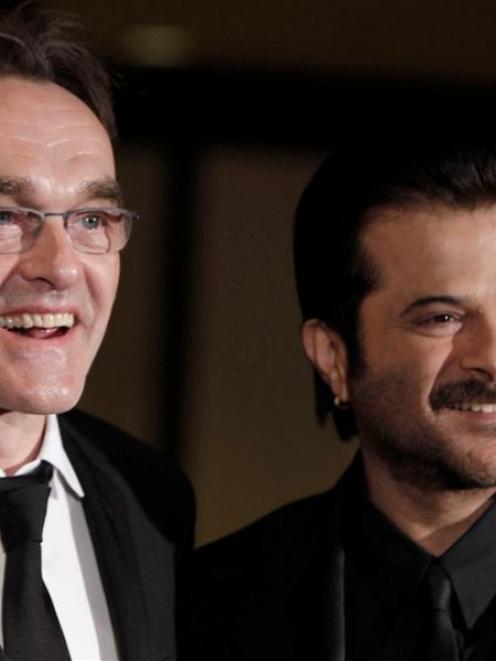 Danny Boyle, left, and Anil Kapoor arrive at the Directors Guild of America Awards on Saturday in...