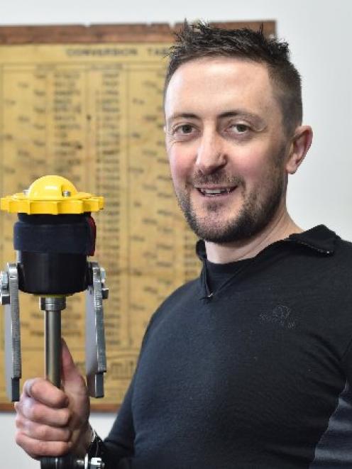 Danny Pryde, of Pryde Engineering, with the mirror adjustment mechanism he designed and made for...