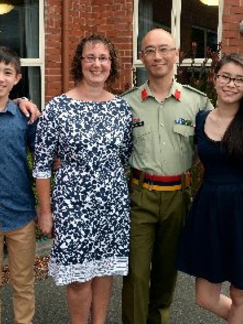 Colonel Darryl Tong with wife Catherine and children (from left) Katie (20), William (12),...