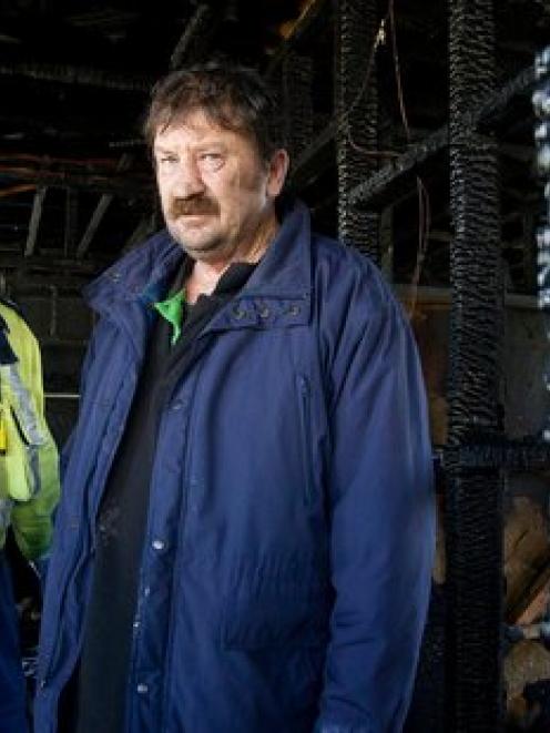 Dave Morris (left) and Dean Corbett inside the house after the early morning inferno. Photo /...