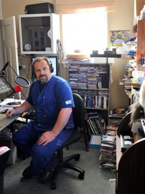 Dave Ure  behind the microphone at his  radio station, 107.5Rocks Dunedin. Photo by Gerard O'Brien.