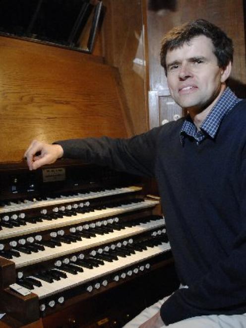 David Burchell (pictured at the Dunedin Town Hall organ console) has been dismissed as director...