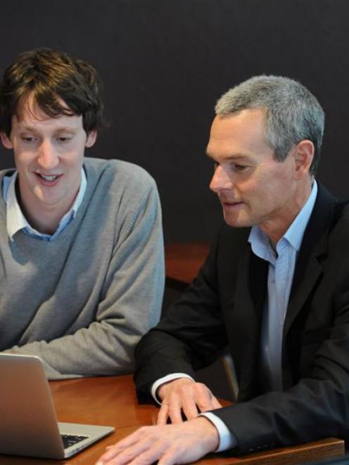 David Cameron (left) updates Altus Financial Services business and sales manager Jerry Pearse...