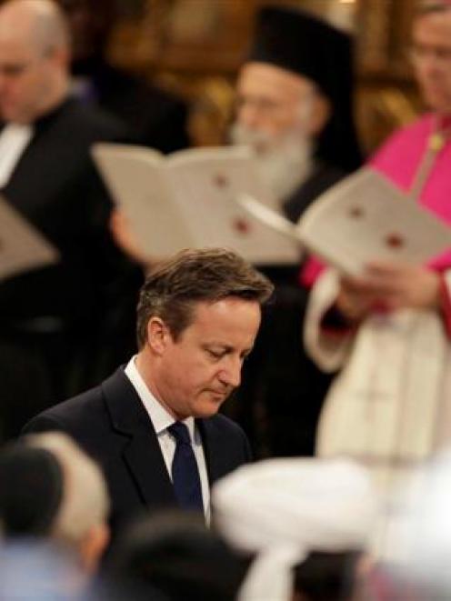 David Cameron walks away after delivering a reading during a service of thanksgiving  at...