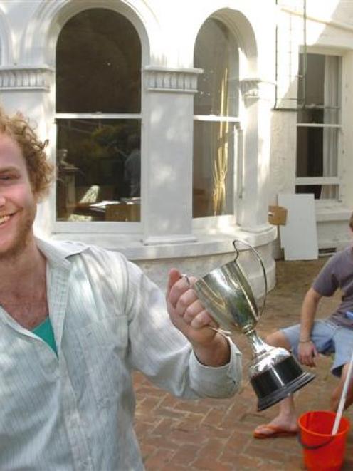David Holmes (left) and Josh Radford take a break from a three-day clean-up of their flat, named...