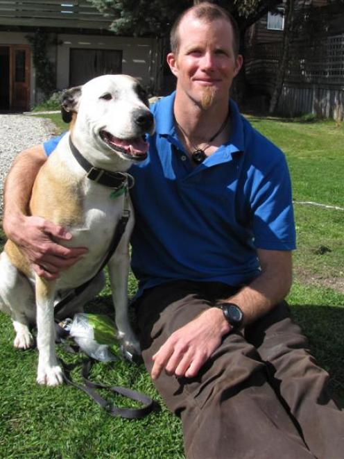 David Lundin with his dog  Bohdi, who no longer has to wear a muzzle when he is taken out for a...