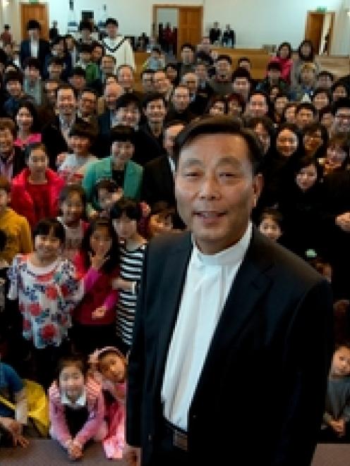 David Ock-Youn Jang with his congregation, who say they trust him and are standing by him. Photo ...