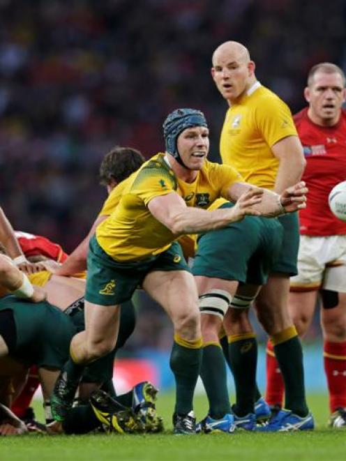 David Pocock clears the ball from a ruck during Australia's win over Wales. Photo: Reuters