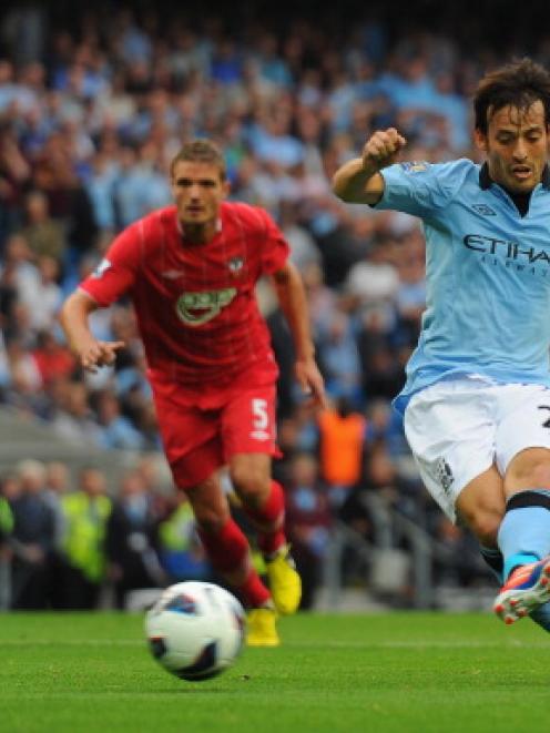 David Silva of Manchester City takes misses a penalty.  (Photo by Michael Regan/Getty Images)