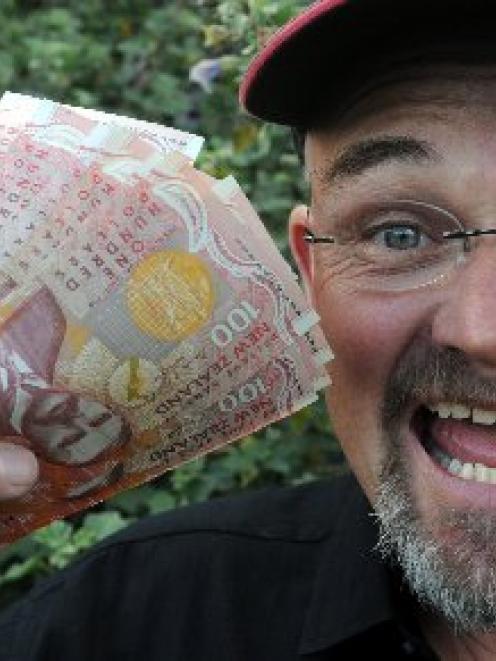 David Symon holds the $2500 he lost in Dunedin on Friday, which was returned to him. Photo by...