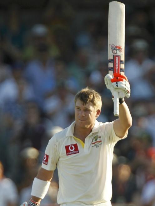 David Warner of Australia celebrates reaching 100 during the third test against India at the WACA...