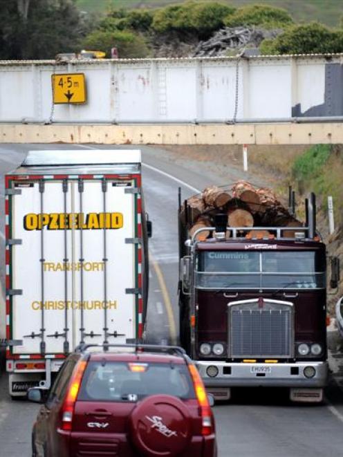 There is not much clearance when two trucks pass under the Deborah rail overbridge just south of...